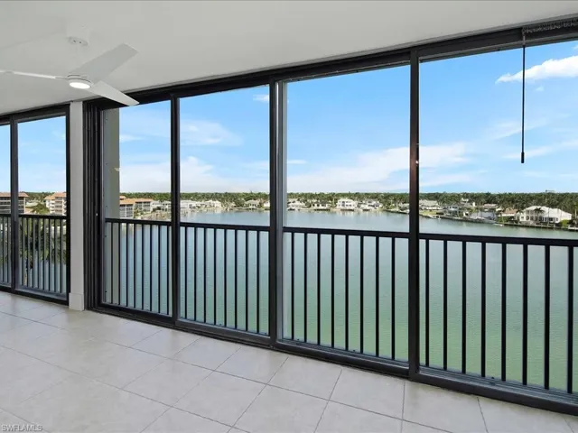 Unfurnished sunroom with a water view