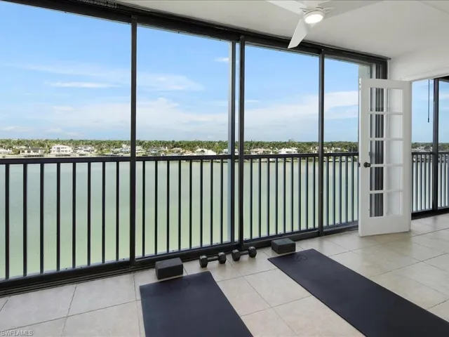 Unfurnished sunroom with a water view