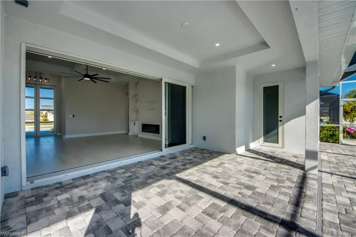 View of patio / terrace with ceiling fan and glass enclosure