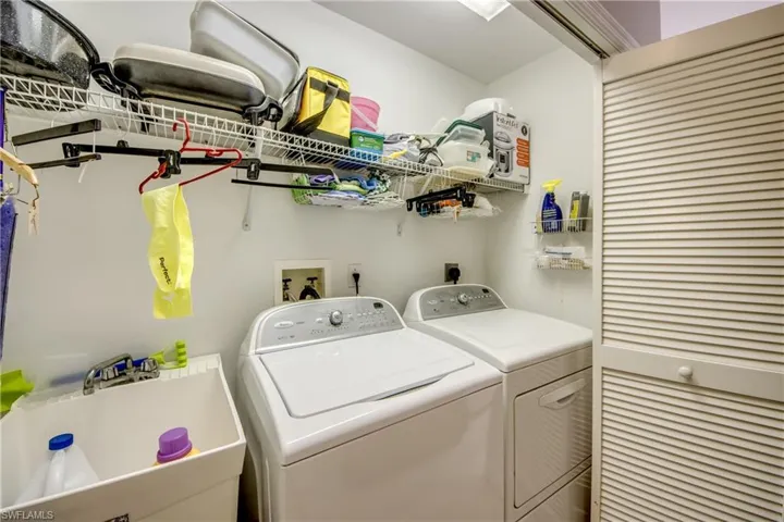 Laundry Closet with Tub located in kitchen.