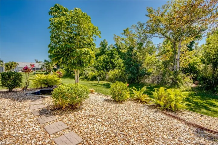 Backyard with small built in pond.