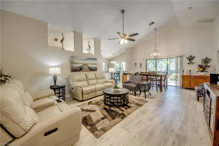 Great Room with updated fans and lighting.  Premium vinyl floors thru out home.