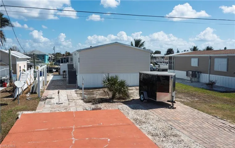 Plenty of Room to add a garage or car port.  Trailer not included in sale