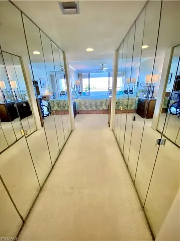 Master bedroom mirrored closets on both sides and the Hallway that connects the Master bathroom and Master bedroom that overlooks the River and golf course view.