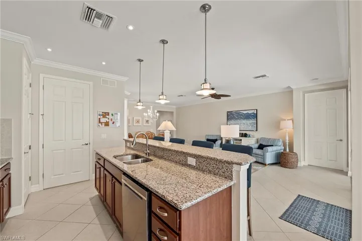 28196 Jewel Fish Ln Bonita Springs FL 34135 - Island kitchen with pantry and laundry room located conveniently