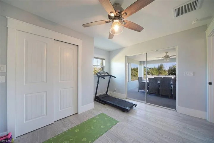 Bedroom/Workout room with wood finished floors and ceiling fan