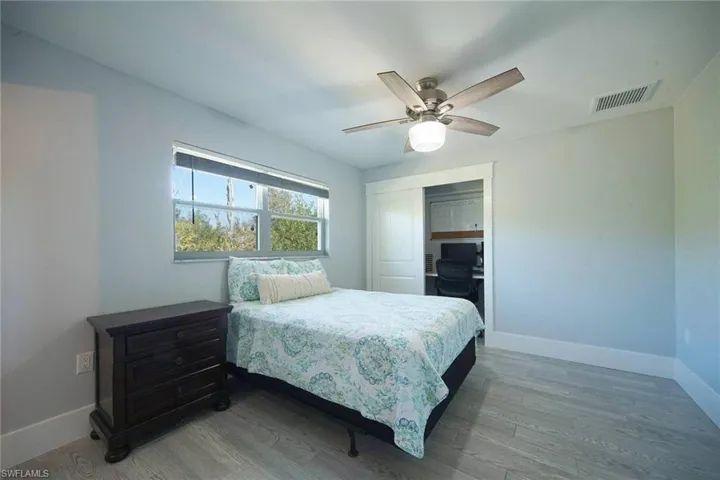 2nd Bedroom featuring light wood-style flooring, ceiling fan, a closet, and optional office area