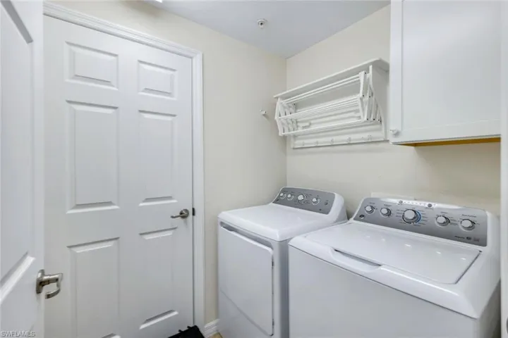 Laundry room featuring cabinet space and washer and dryer