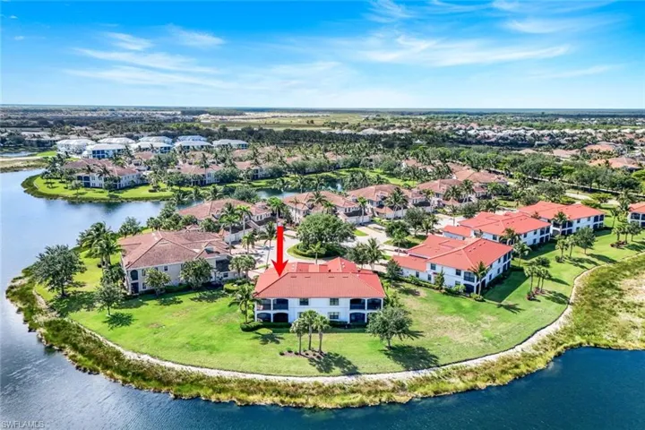 Aerial perspective of suburban area with a nearby body of water