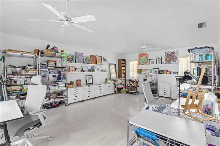 Bonus room with slider to the pool, current owners art gallery but 16 X 23 with barn doors to the kitchen.....can be used as family room or hobby room