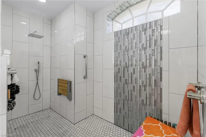 Bathroom featuring tiled shower
