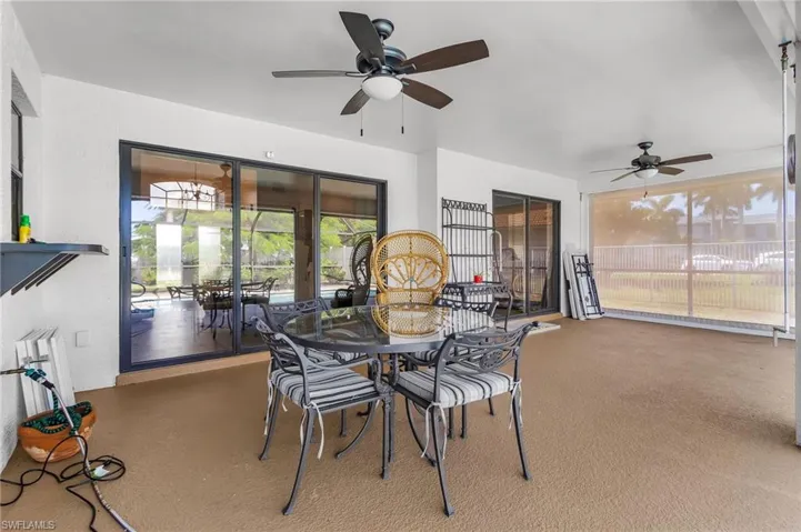 pass thru window from kitchen, pocket sliders from the living room, sliders from the Primary Bedroom and roll down hurricane screens all around the patio