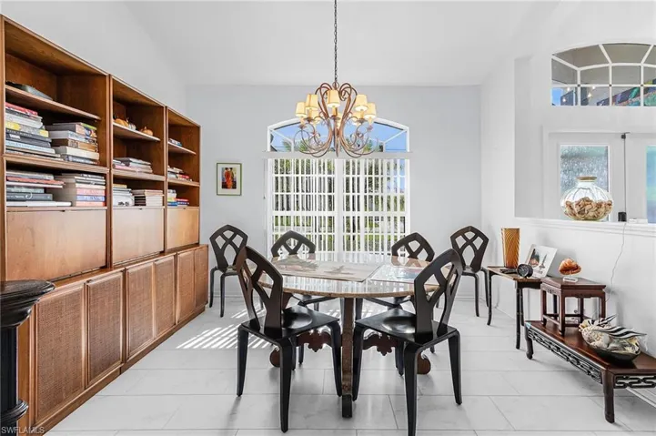 Dining room with a chandelier and luxury vinyl flooring and open concept
