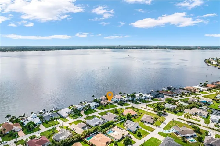 Aerial view of residential area with a view of the intercoastal waterway (Caloosahatchie River leading to the Gulf of America to the south or the Okechoobie Locks to go the the East Coast of Florida). Ft Myers is visible across the River