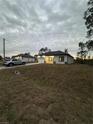 View of yard with a garage