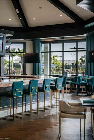 Bar featuring beam ceiling, recessed lighting, and open shelves
