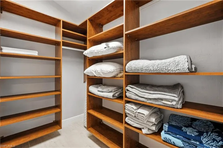Walk in closet featuring light wood finished floors
