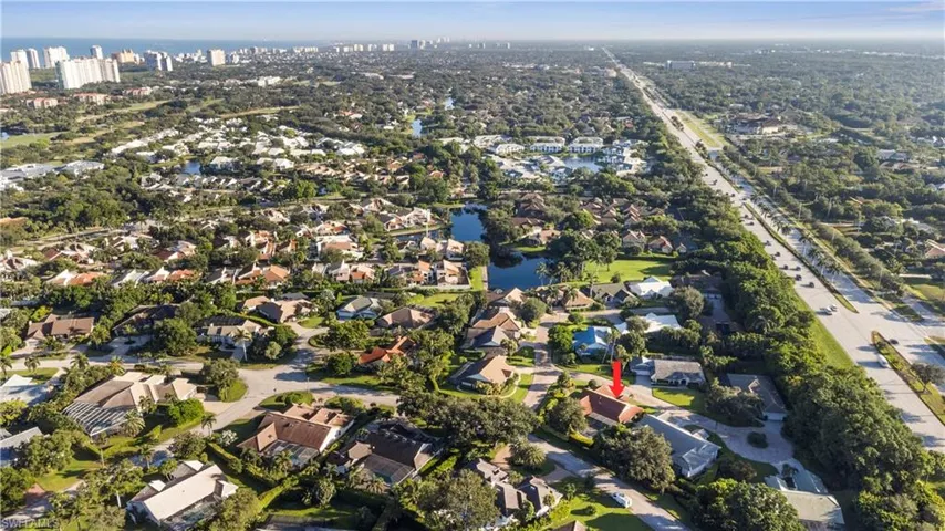 View of property location with a large body of water and nearby suburban area