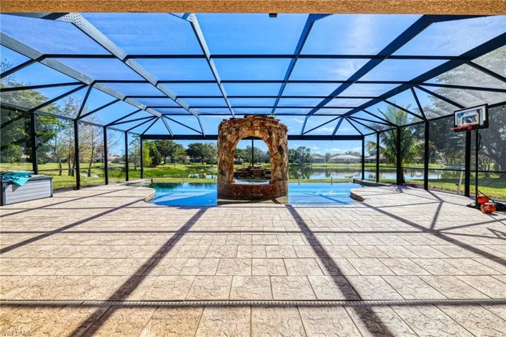 View of pool with a water view