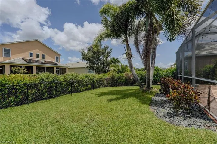 View of yard with a lanai