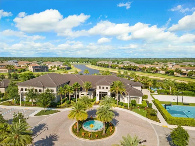 Aerial perspective of suburban area featuring a large body of water