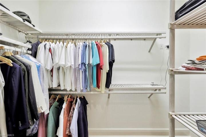 Primary Bedroom Walk in Closet 1 of 2