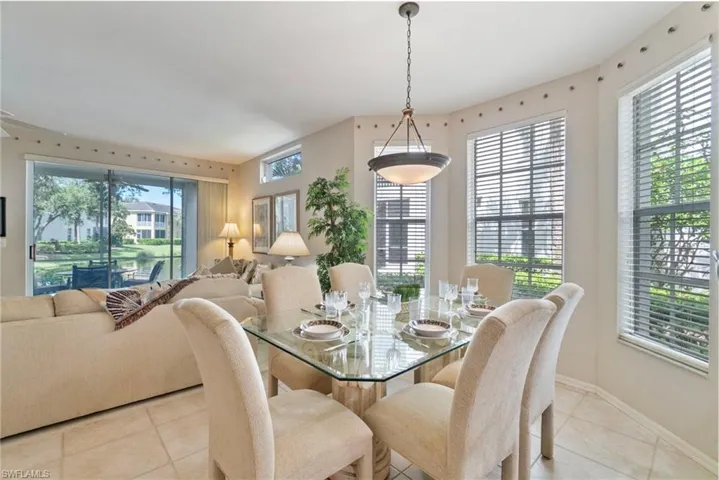 Dining area with plenty of natural light and light tile patterned floors