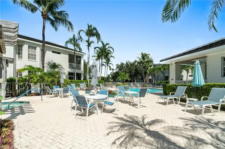 Community pool with a patio
