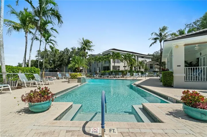 Community pool with a patio