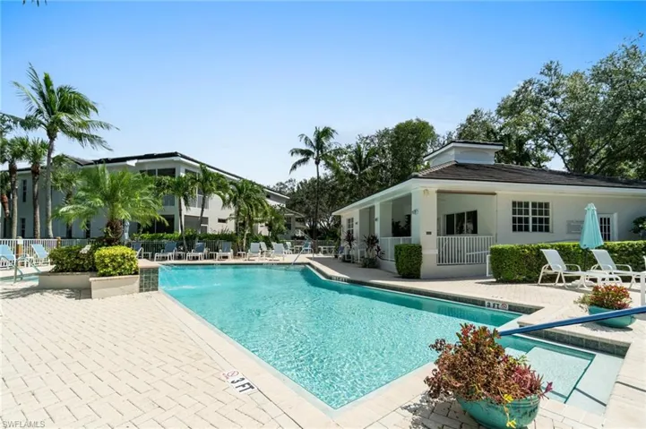 Community pool with a patio area