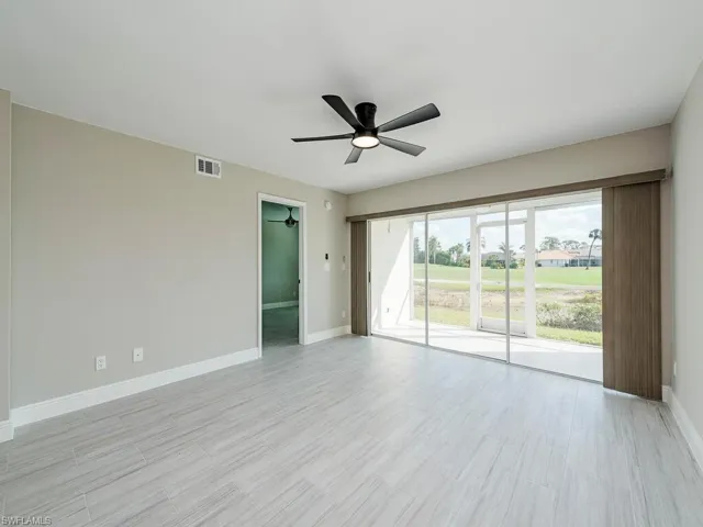 Unfurnished room featuring ceiling fan