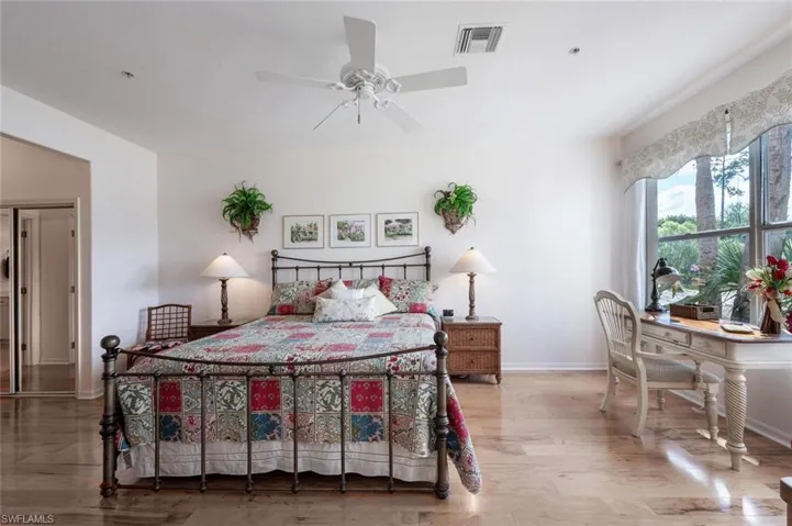 Master Bedroom featuring baseboards and wood finished floors