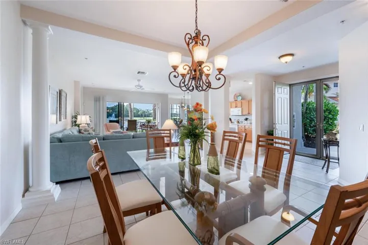 Dining area with light tile patterned floors, plenty of natural light, and baseboards