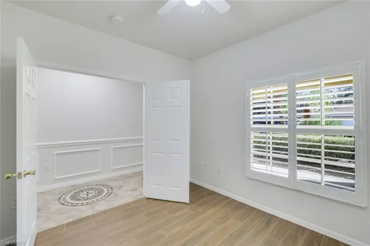 Unfurnished bedroom featuring ceiling fan