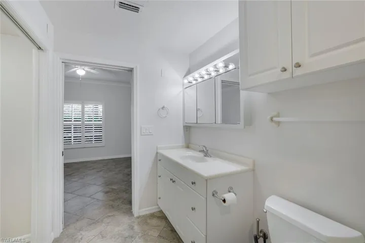 Bathroom with vanity and toilet