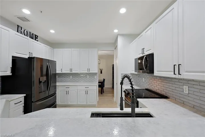 Cristallo Granite Counters and Tile Backsplash