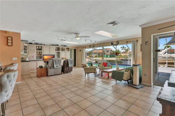Great Room with built in custom cabinetry and fabulous waterview