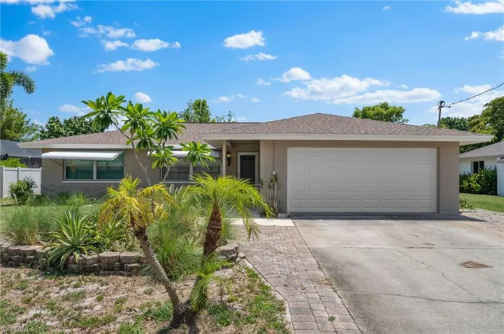 Single story home featuring a garage