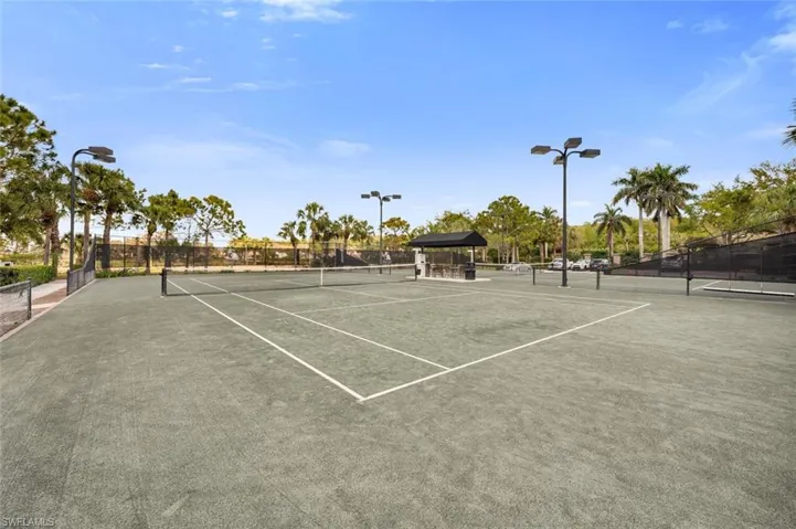 View of tennis court featuring a gazebo