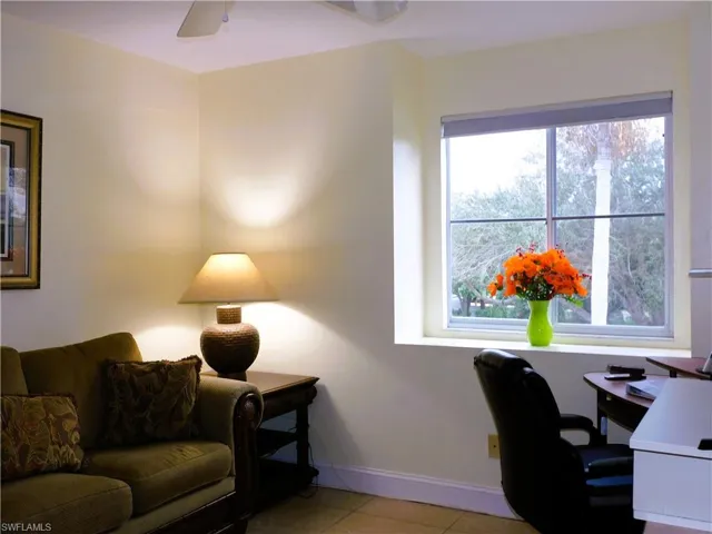 Office with baseboards and light tile patterned floors