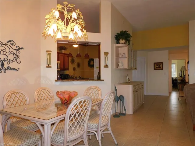 Dining space featuring light tile patterned floors