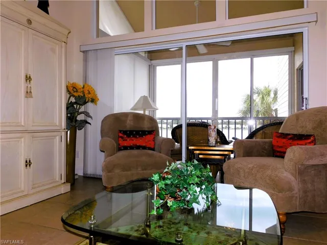 Sitting room featuring plenty of natural light and tile patterned flooring