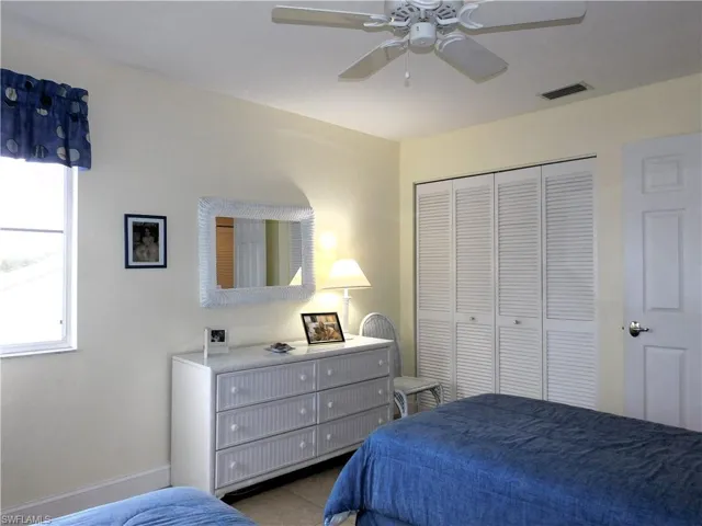 Bedroom featuring a closet and ceiling fan