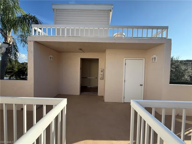 Property entrance with stucco siding