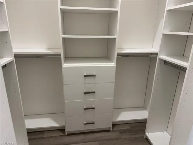 Spacious closet featuring built ins