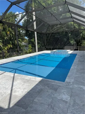 View of pool and sun shelf