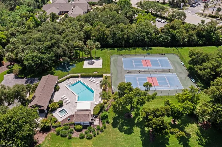 Community center with pool, hot tub, tennis/pickleball courts, basketball and swing set