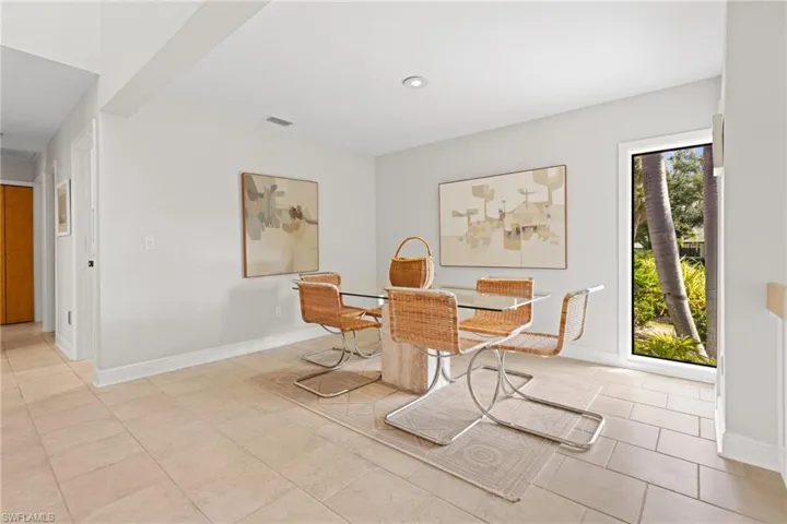 Tiled dining area with a wealth of natural light