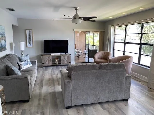 The Living area has slider door access to the screened balcony and the large windows provide plenty of natural light and great views.