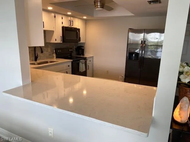 The Kitchen pass through counter bar has seating on both sides. Great for entertaining or enjoying a snack.